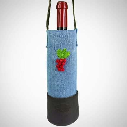 Front view of a handcrafted denim wine bag by Sear Handcrafted Elegance, holding a 750ml wine bottle. Features a leather strap, embroidered grapes, and a rustic leather base. Ideal for gifting wine lovers.