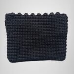 Sear Handcrafted Elegance brand handmade leopard print black crochet clutch bag, back view. Features a fully crocheted black exterior, highlighting the intricate craftsmanship.