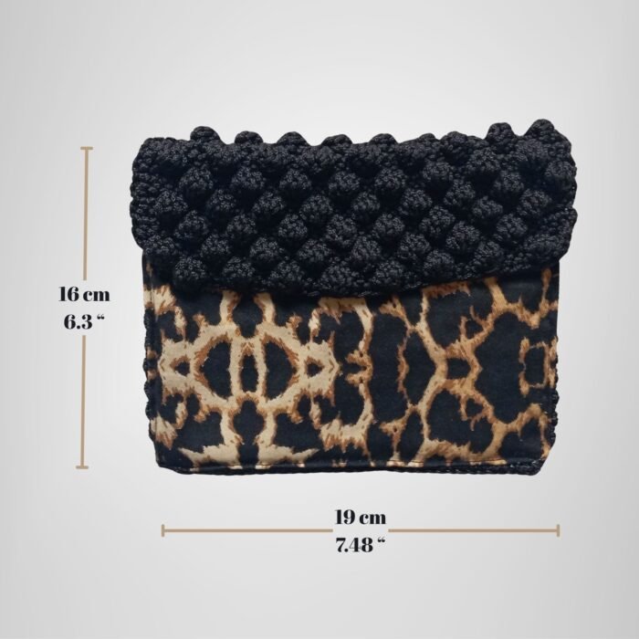 Sear Handcrafted Elegance brand handmade leopard print black crochet clutch bag, dimensions view. Measures 19 cm (7.48") wide and 16 cm (6.3") tall, perfect for essentials.