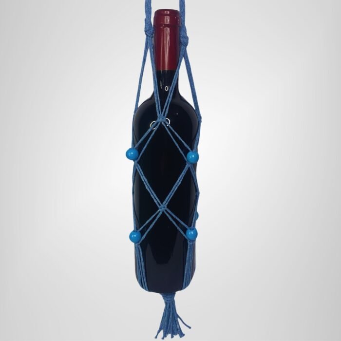 A Sear Handcrafted Elegance macrame wine bottle bag in blue, handmade from 100% recycled cotton, holding a wine bottle. The bag features an intricate knot design with blue decorative beads and a tassel at the bottom, displayed against a plain background.