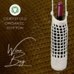 Beige handmade crochet wine bottle bag, crafted from certified organic cotton. Stylish and sustainable design, ideal for wine gifts.