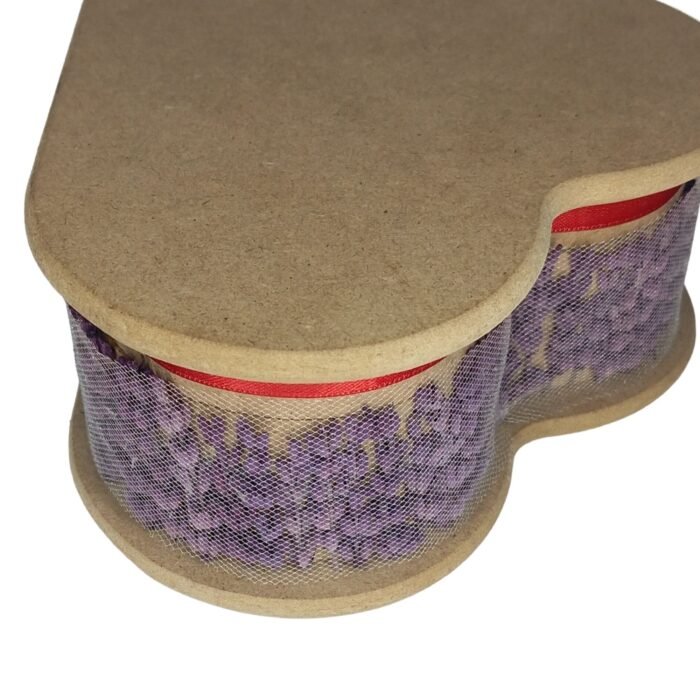 Closed heart-shaped wooden box with a red ribbon and lace, featuring an everlasting red rose and lavender, perfect for a romantic gift.