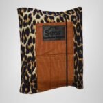 Leopard print book organizer bag with brown fabric pockets and Sear Handcrafted Elegance brand label, front view.