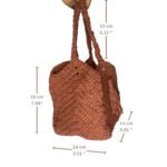 A detailed dimensions view of the Sear Handcrafted Elegance terracotta crochet tote bag, showcasing its warm brown hue and intricate crochet design. The bag measures 18 cm (7.09") in height, 14 cm (5.51") in width, and 13 cm (5.12") in handle drop, as indicated by labeled measurements. Featuring a tassel accent, this handmade tote combines rustic style with practical sizing, perfect for everyday use. The bag is held by a hand against a white background, highlighting its textured craftsmanship.